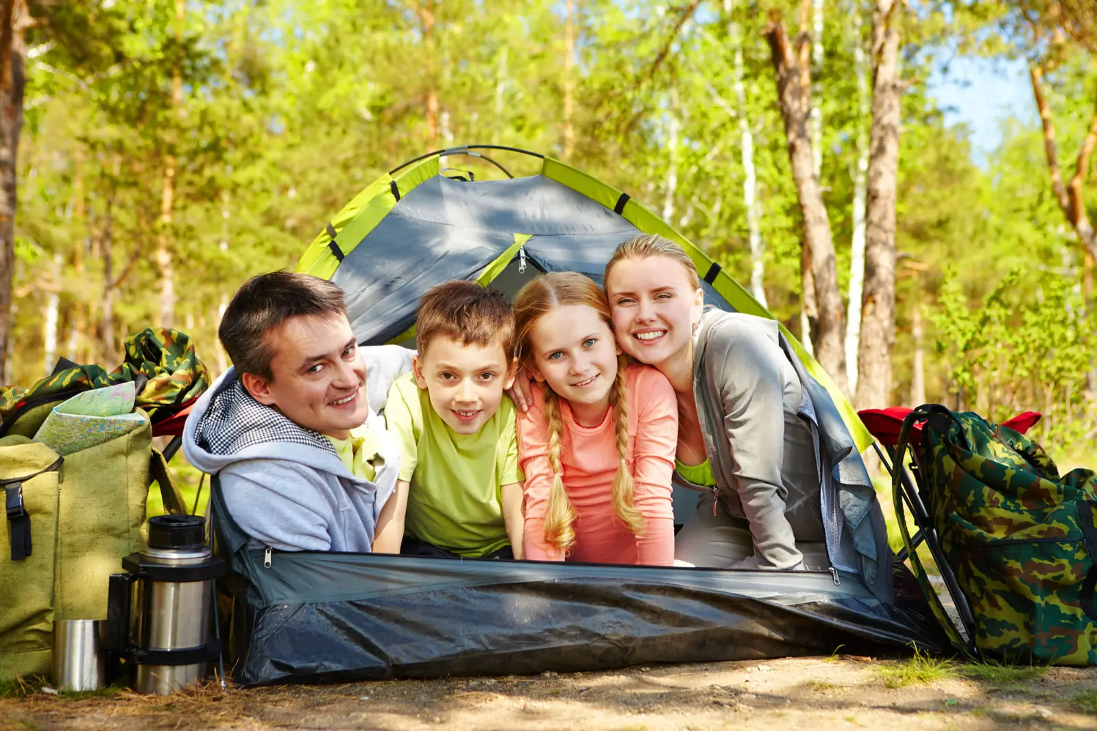 Family camping at RV tent site